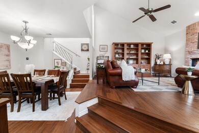 Dining room with stairs, wood finished floors, a 