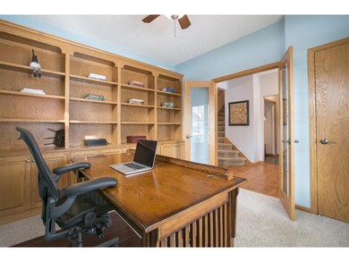French doors open to the main floor study with bui