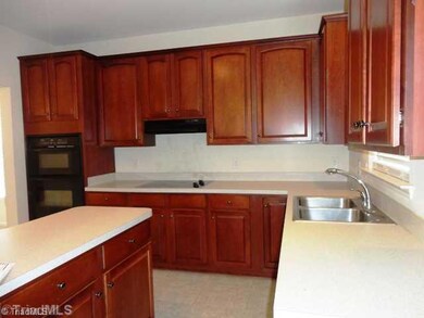 Kitchen. Open kitchen with center island and plenty of cabinet space.