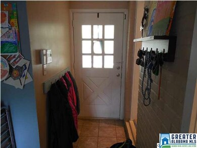 Mud room entry from 2-car carport