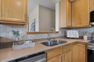 Look out from the kitchen to the dining room and living room.