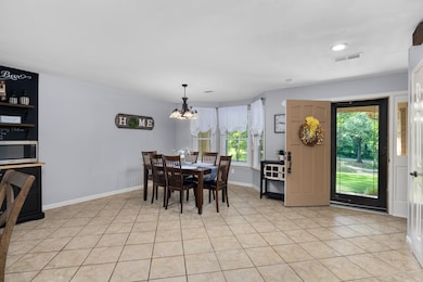A view looking back at the dining area from the living room off of the kitchen.