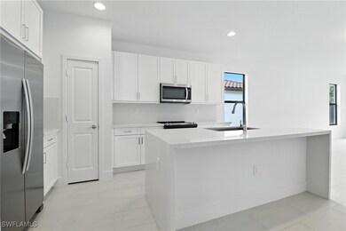 Kitchen featuring stainless steel appliances, whit