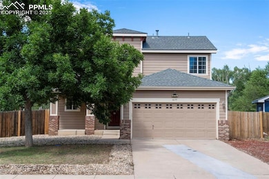 View of front of home featuring concrete driveway, brick siding, an attached garage, and a shingled roof