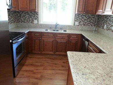 Spacious open kitchen with newer cabinets & stainl