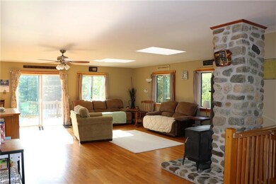 Living room with heat stove and...