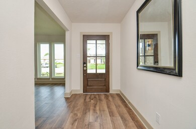 Front Entry is openb to the dining room and featur