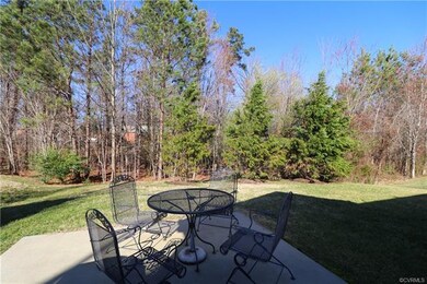Rear private patio just steps from morning room
