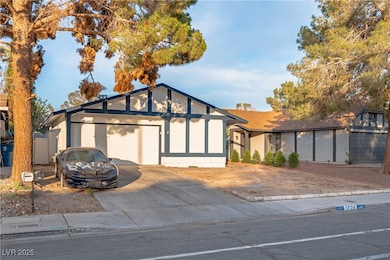 View of front of property featuring driveway and a