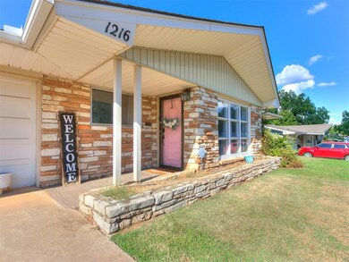 Entrance to property featuring a porch and a lawn