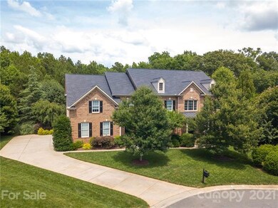 Stately Full Brick Home with Lush landscaping.