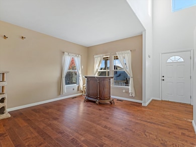 Entryway with dark wood finished floors