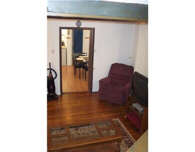 Living Room. Living room to view of kitchen..picture also shows wooden floors