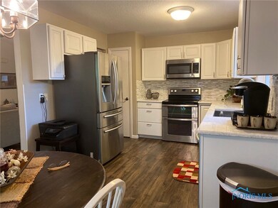 Kitchen features stainless appliances and a pantry