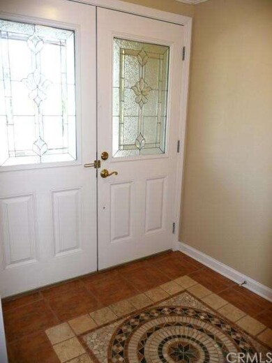 ENTRY FOYER WITH COAT CLOSET.