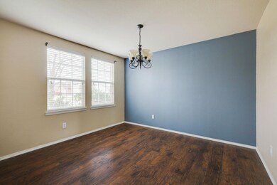 Spare room with dark hardwood / wood-style floorin