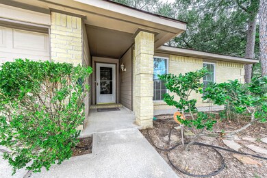 Approaching the front door is the covered front po