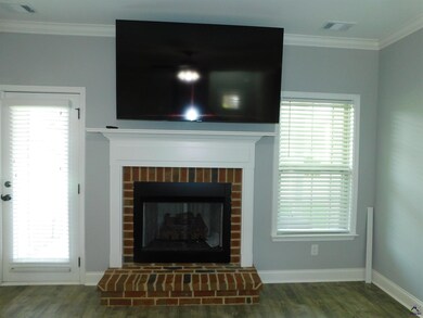Living room has a gas fireplace and comes with 70i