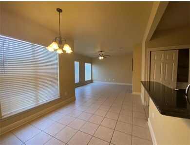 Dining and living areas features large windows for