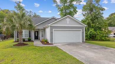 Ranch-style house featuring concrete driveway, a f