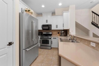 Kitchen featuring stainless steel appliances, a s