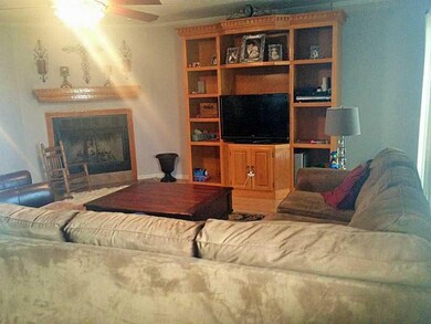 Living Room. Living features corner fireplace,buil