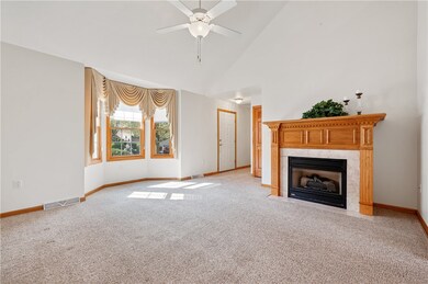 The spacious living room offers a large front bay
