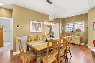 Dining for 8 and LVP floors flow from entry throug
