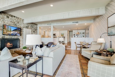 Living room with recessed lighting, visible vents
