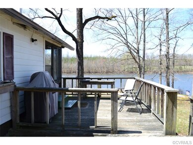 Enjoy grilling and relaxing on this side deck.  En