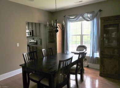 Lovely dining room offers plenty of space for entertaining or large families.