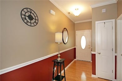 Foyer in front door with bedroom and bath at front