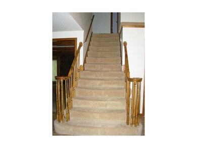 Stairway from entryway to upper level