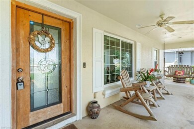 View of exterior entry with stucco siding and ceil