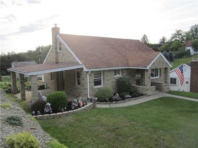 Exterior Front. PROFESSIONALLY LANDSCAPED CONCRETE