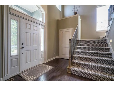 Lovely entry with hardwood, extra wide staircases,