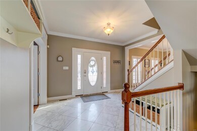 Foyer with dinning room to the left and den/office
