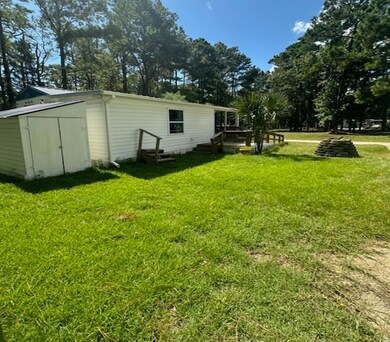 View of yard with a storage shed
