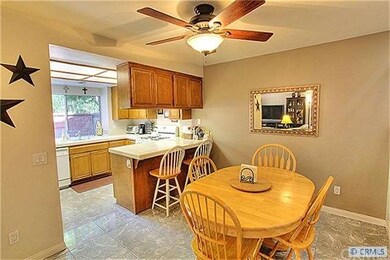 Open dining an kitchen offers plenty of counter sp