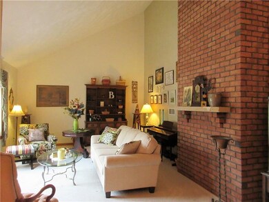 The living room wows visitors with its cathedral c