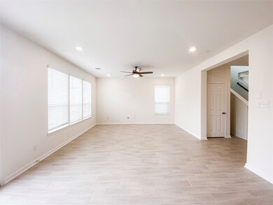 Spacious combined dining and family room with wood