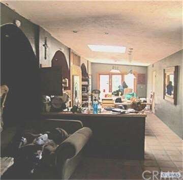 large open floor plan flows through kitchen into b