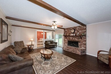 Large living space with gas fireplace. New tile in
