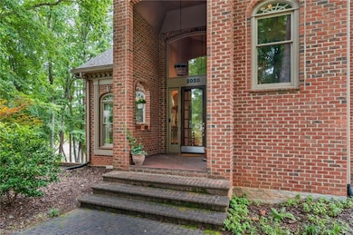 Such a majestic entry for this custom brick home.