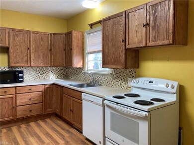 The 1st of 4 views of the eat-in kitchen w/ample c