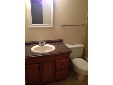 Bathroom featuring vanity, tile patterned floors,