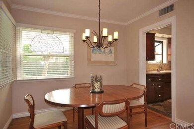 Formal dining area has corner window