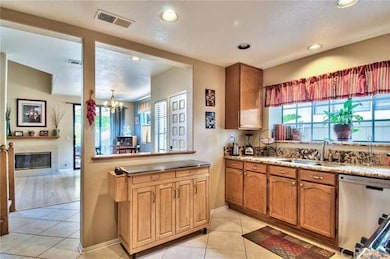 Partial view of the kitchen and the living and din