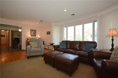 The walk out bay window in the living room adds di