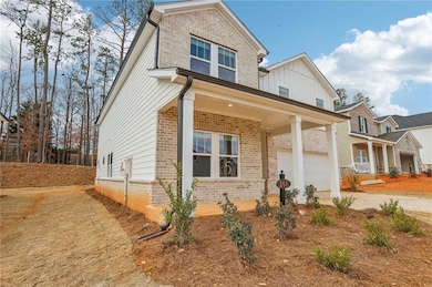 View of front of property with a garage, driveway,